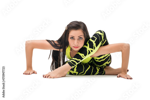 Beautiful brunette practising her yoga routine photo