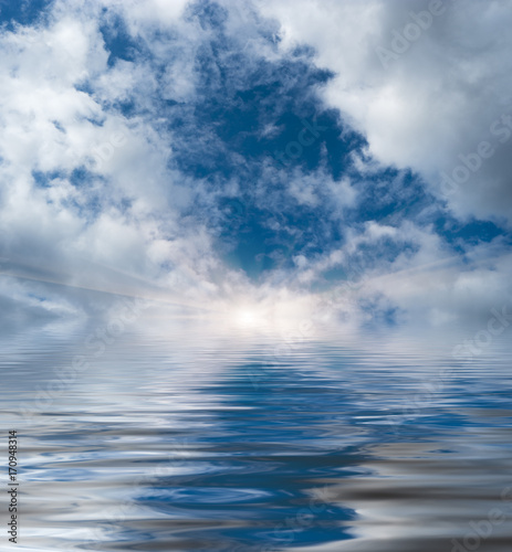 Reflection of a cloudy sky in water
