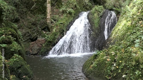 Visiting waterfall die Rausch at wild Endert stream next to Cochem, Mosel River (Germany). photo