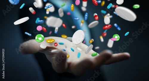 Wallpaper Mural Businessman holding and touching floating medicine pills 3D rendering Torontodigital.ca