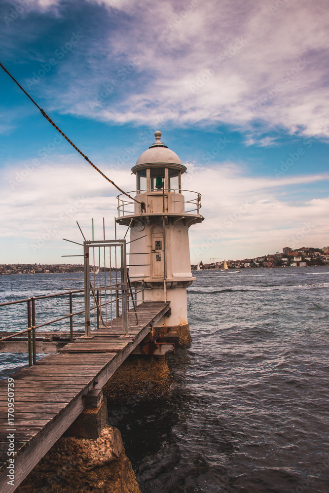 Lighthouse against a wintery sea