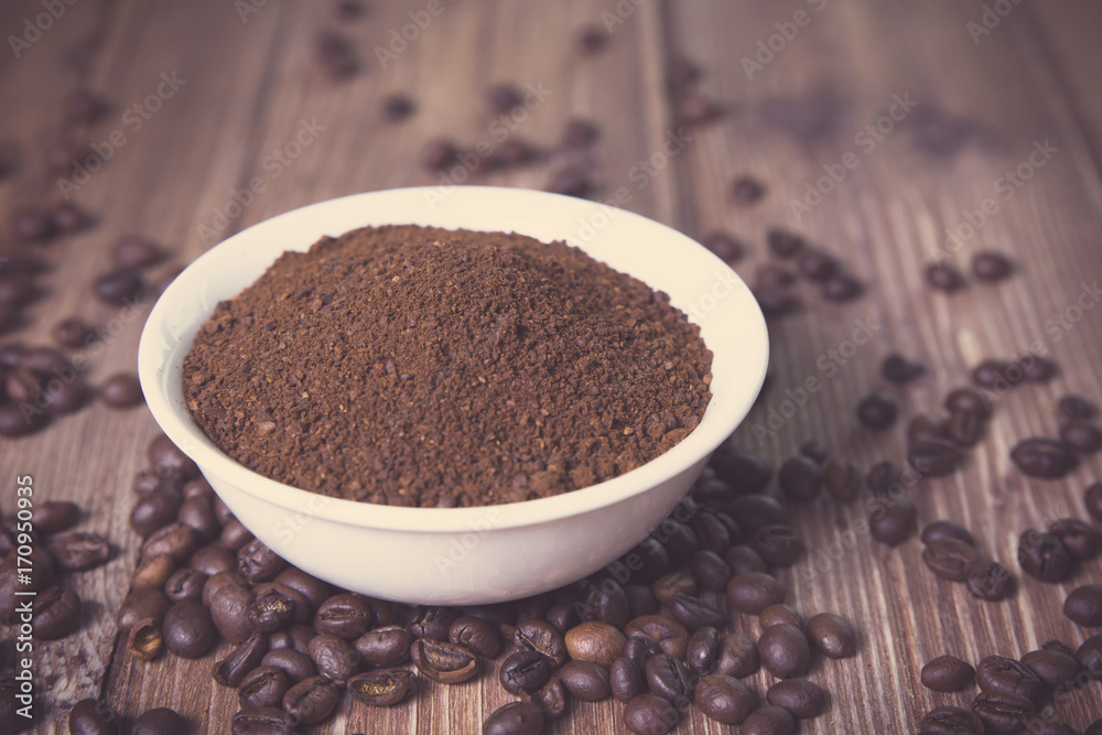 bowl with ground coffee and coffee beans bowl with ground coffee and coffee beans