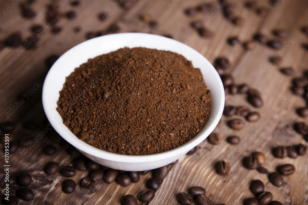 bowl with ground coffee and coffee beans bowl with ground coffee and coffee beans