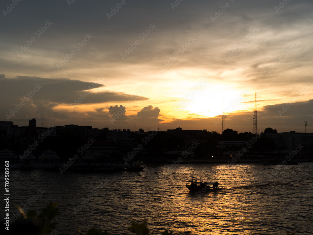 silhouette of boat in sunset time in Bangkok river