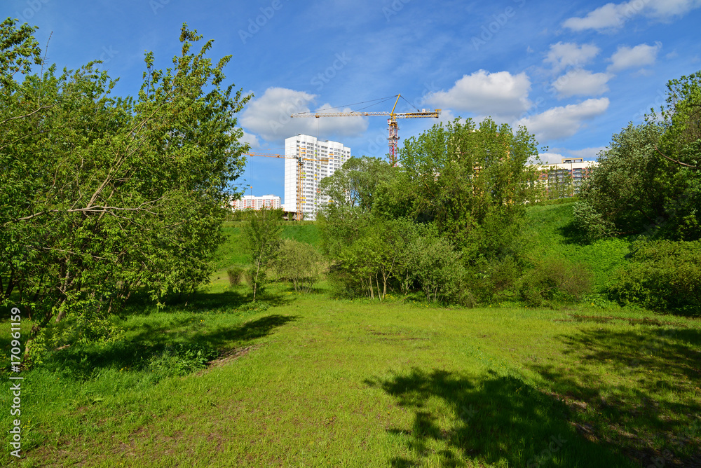 Construction of residential houses near park in Moscow, Russia Construction of residential houses near park in Moscow, Russia