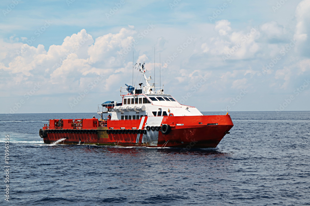 Supply boat transfer cargo to oil and gas industry and moving cargo from the boat to the platform Supply boat transfer cargo to oil and gas industry and moving cargo from the boat to the platform