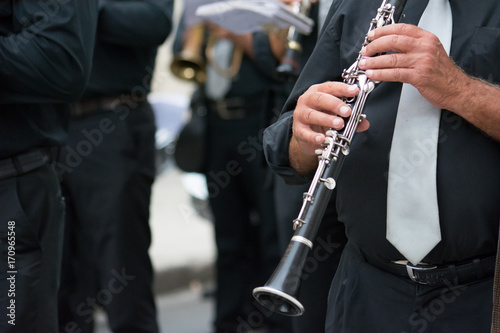 clarinet band musician walking in the street