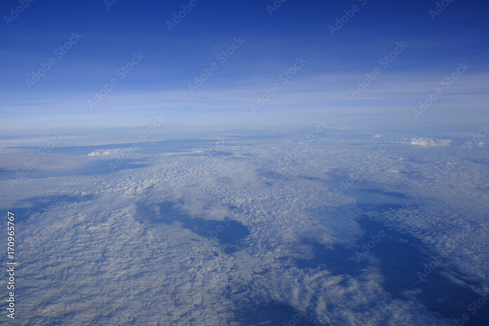 A picture of sky above the cloud from airplane window, Soft focus