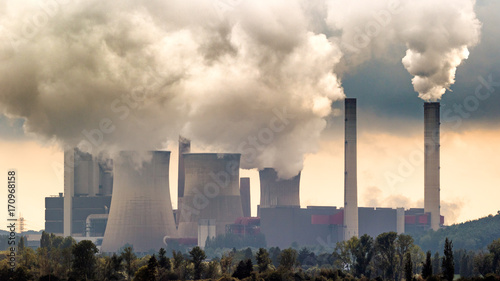 Large fossil fuel power plant station emission causing air pollution.