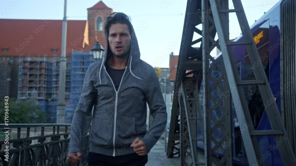Talented boxer running in the urban surroundings Talented boxer running in the urban surroundings