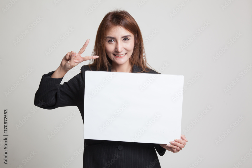 Young Asian business woman show victory sign with blank sign. Young Asian business woman show victory sign with blank sign.