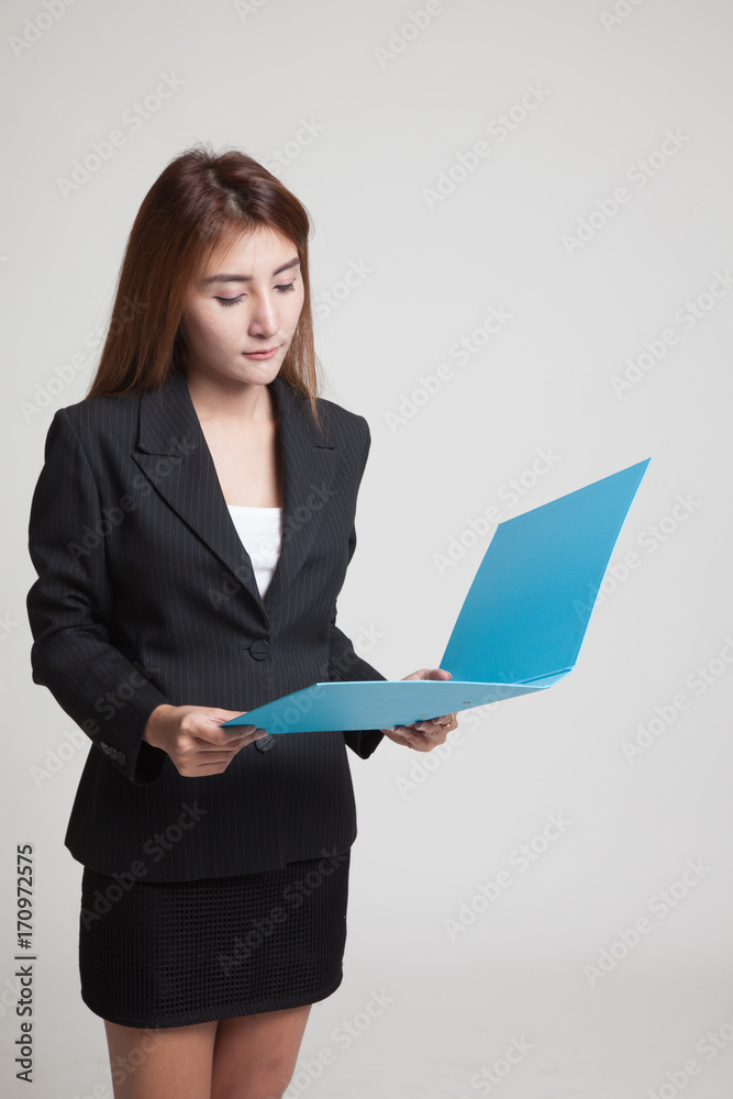 Young Asian woman with folder. Young Asian woman with folder.