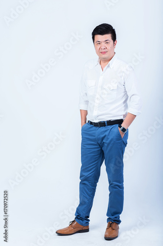 studio portrait of an asian businessman. © whyframeshot