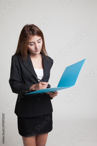 Young Asian woman with folder.