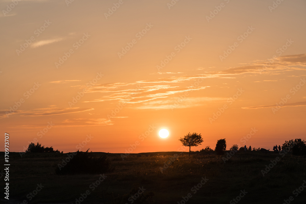 Colorful sunset by a plain grassland