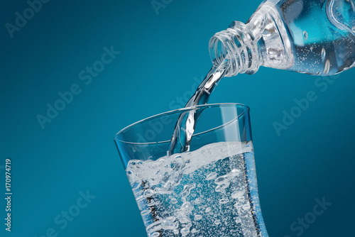 Pouring fresh water into a glass