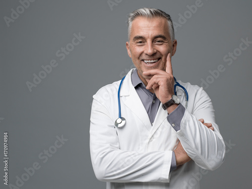 Smiling confident doctor portrait photo