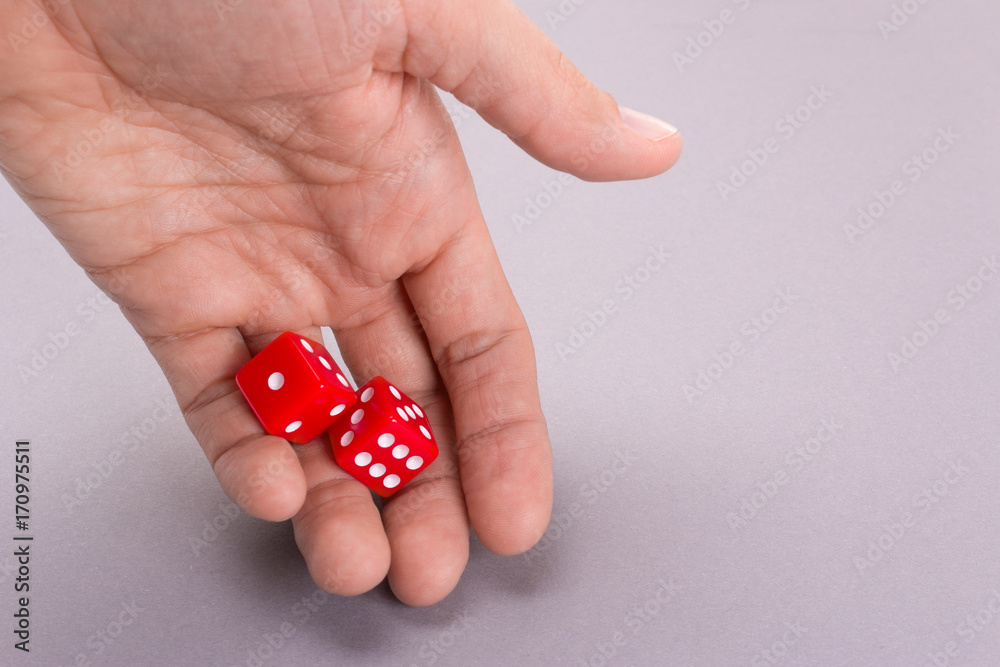 Dice red in the hands of a man Dice red in the hands of a man