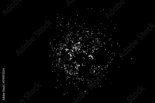Abstract grainy texture isolated on black background. Top view. Dust, sand blow or bread crumbs. Silhouette of food flakes such as salt or almond or wheat flour spread on the flat surface or table. photo