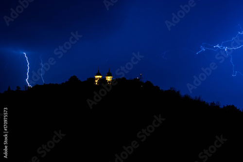 Lightning stike over the chapel during the storm photo