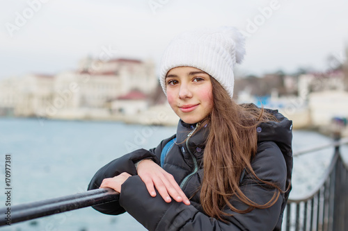 Portrait of kid girl on sea background