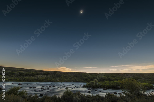 Full solar eclipse over the upper Green River in Wyoming.