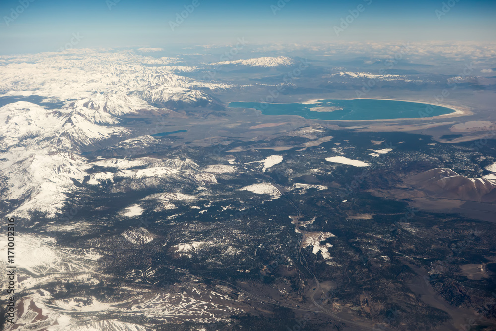 flying over california mountains in spring