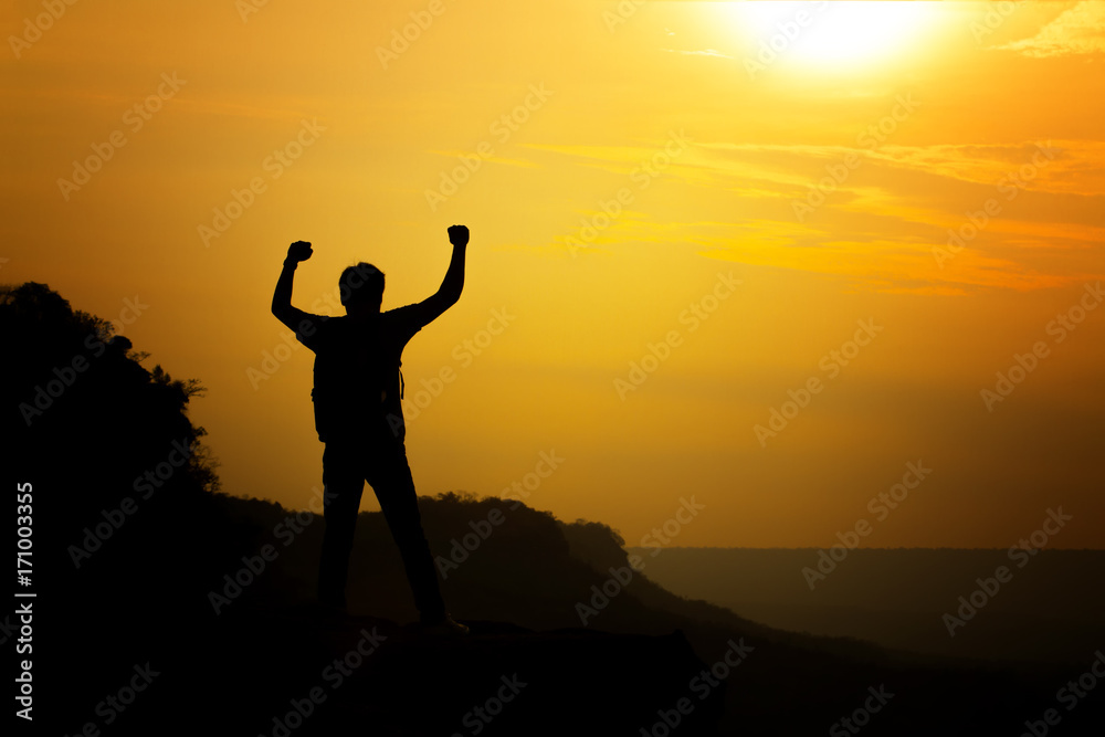 silhouette of man travel show arm up for achievements successful and celebrating success with sunrise silhouette of man travel show arm up for achievements successful and celebrating success with sunrise
