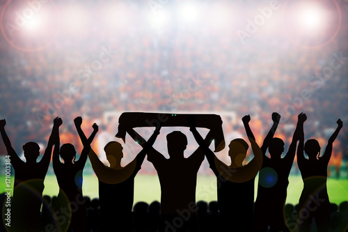 Konstfotografi silhouettes of Soccer fans in a match and Spectators at football stadium