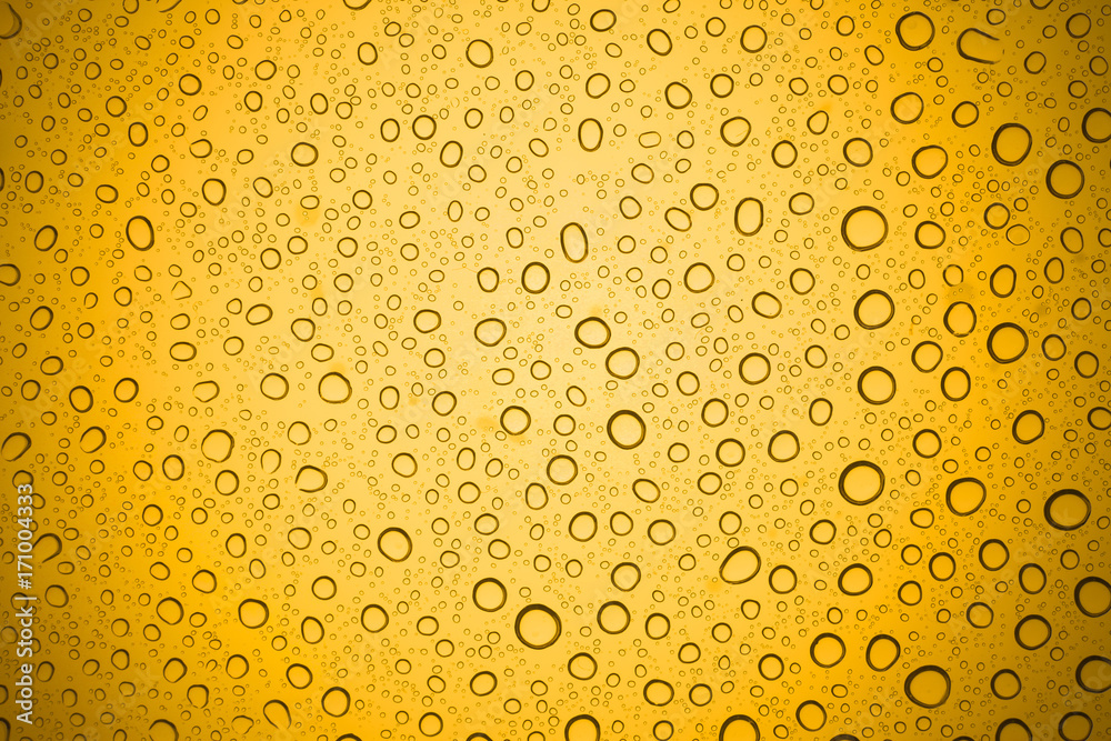 Water drops on yellow glass, Rain droplets on glass background. Water drops on yellow glass, Rain droplets on glass background.