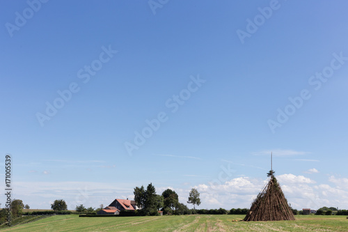 for a midsummer festival bonfire on a very sunny day in august in south germany you see woodpile for a huge fire