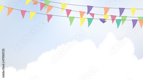 Celebration/party flags hanging in the air with bright blue sky and cloud background