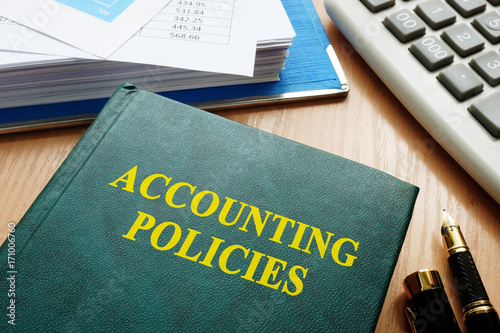 Book with title accounting policies on a table.