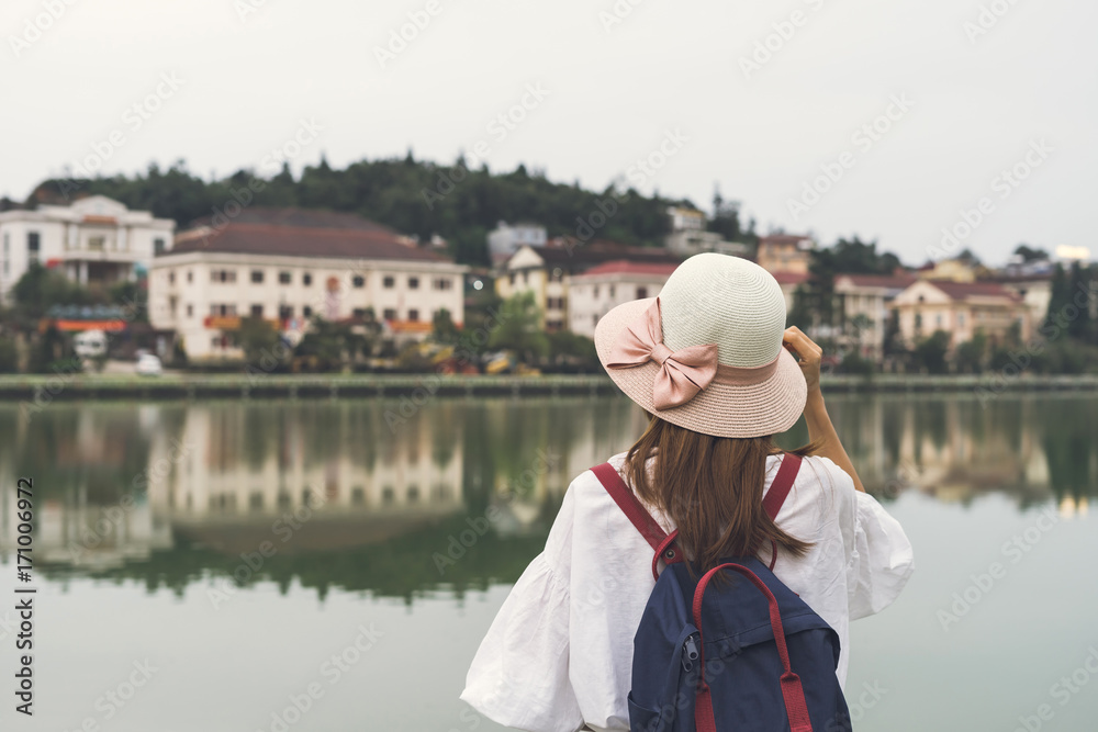 Young asian traveler with backpack at Sapa lake, Vietnam