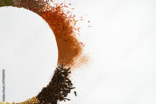 Fototapeta Naklejka Na Ścianę i Meble -  Circle frame composition of spices and herbs isolated on white