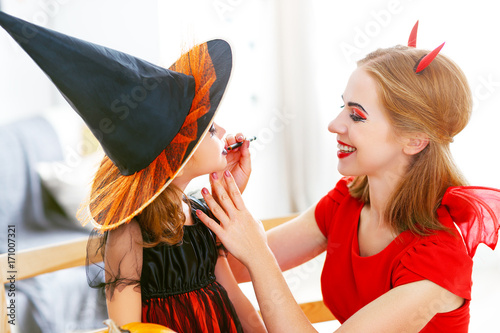 happy family  getting ready for halloween make make-up. photo