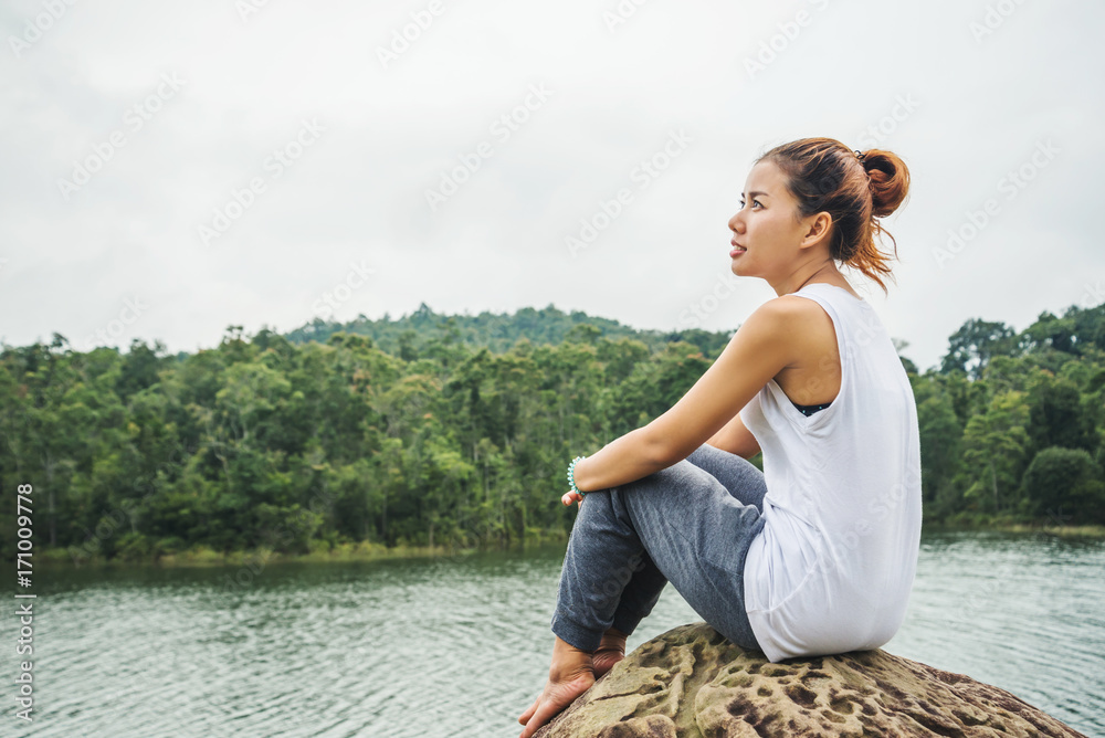 Asian women relax in the holiday. In the natural atmosphere, mountain forest.