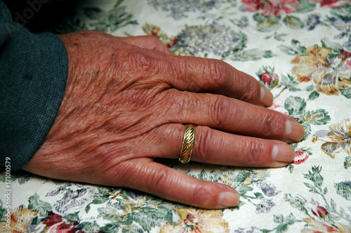 Elderly man's hand with wedding ring