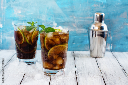 Bilde på lerret Summer cuba libre cocktail with lime and mint. Space for text