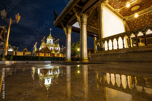 Loha Prasat with perfect water reflection, famous Wat Ratchanatda in Bangkok, Thailand