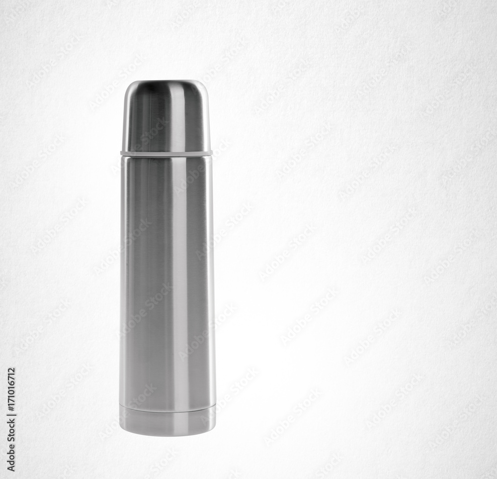 Thermo or Thermo flask from stainless stee on background. Thermo or Thermo flask from stainless stee on background.