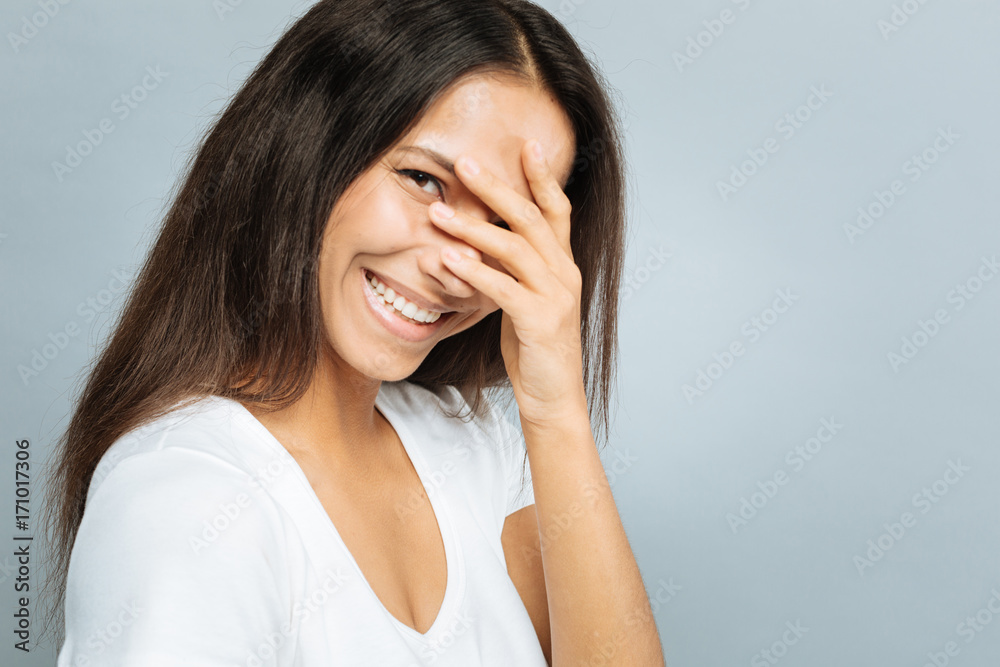 Portrait of delighted female that covering eyes Portrait of delighted female that covering eyes