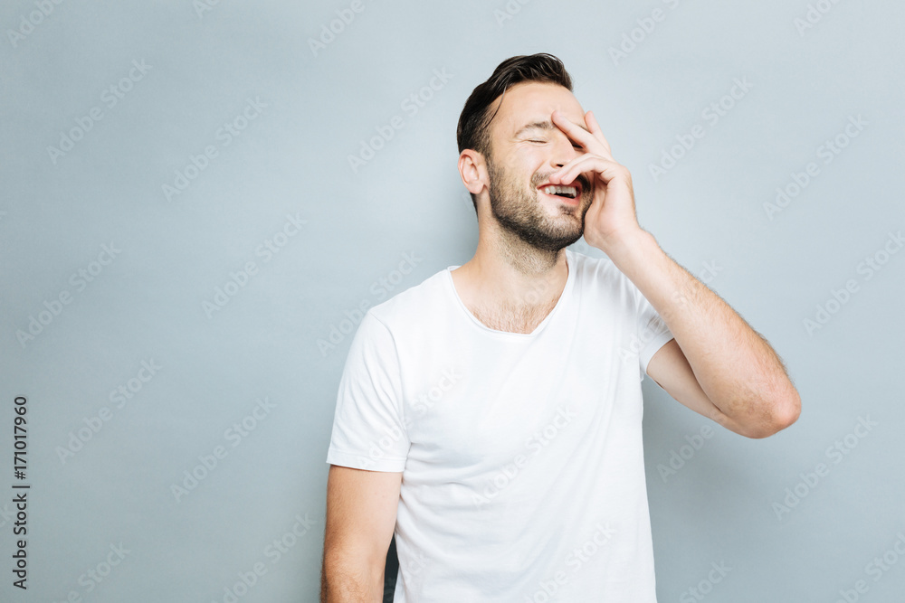 Fototapeta premium Delighted guy feeling happiness at the moment