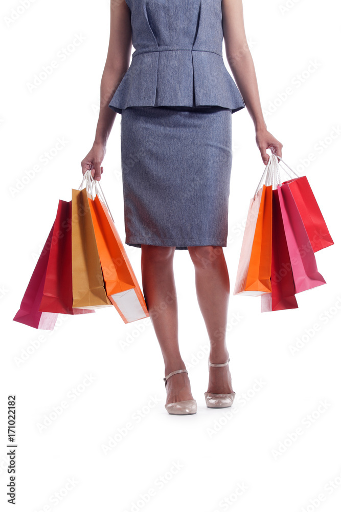 woman carrying colorful shopping bag isolated on white background.