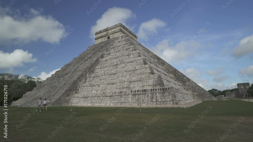 CHICHEN ITZA, MEXICO - MAY 25, 2017: Movement around Maya pyramid temple of Kukulkan in Mexico on the background at cloudy sky CHICHEN ITZA, MEXICO - MAY 25, 2017: Movement around Maya pyramid temple of Kukulkan in Mexico on the background at cloudy sky