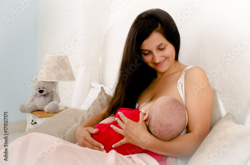 Obraz na płótnie Breastfeeding baby. Mother nursing her child. Newborn eat breast milk. w salonie