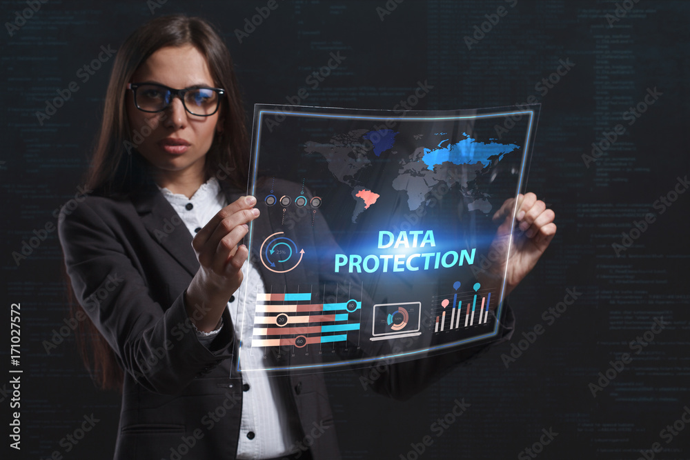 The concept of business, technology, the Internet and the network. A young entrepreneur working on a virtual screen of the future and sees the inscription: Data protection The concept of business, technology, the Internet and the network. A young entrepreneur working on a virtual screen of the future and sees the inscription: Data protection