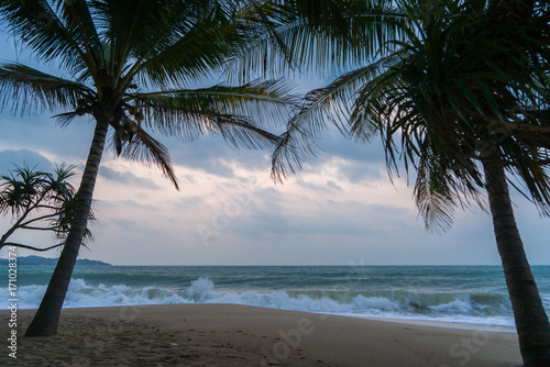 Sunset Beach with palm trees and beautiful sky.