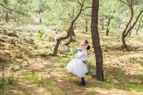 Romantic dating. Young loving couple embracing on nature photo