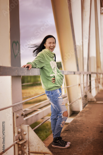 autumn, a girl on a railway bridge